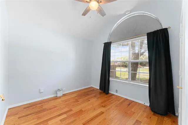 a bathroom with a sink a tub and a mirror