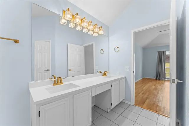 a white bath tub sitting next to a shower