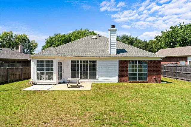 a view of a swimming pool with an outdoor space and seating area