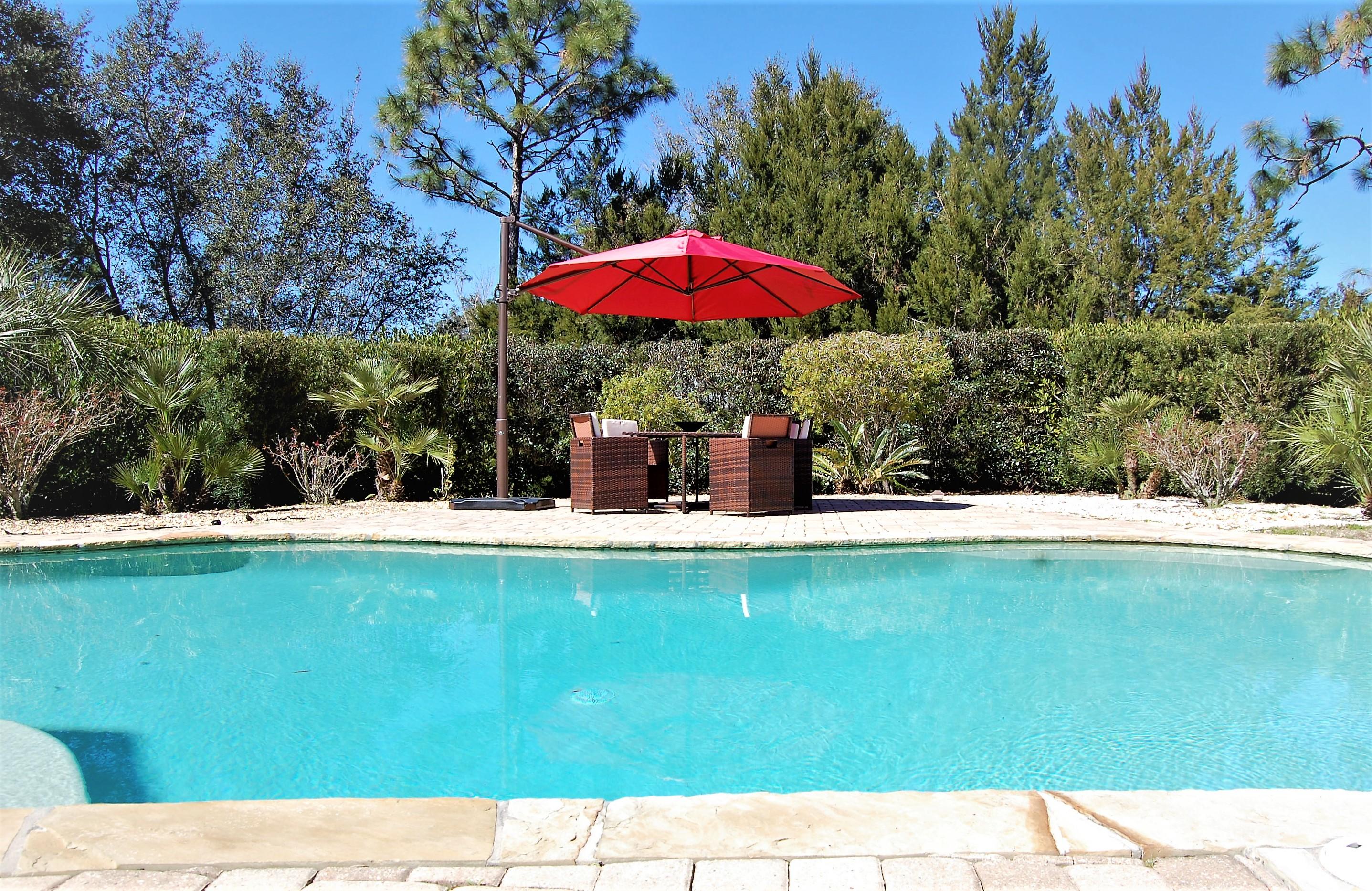 2497 Crescent Road Navarre, FL 32566 - Photo 1 of 51 a view of swimming pool with a table and chairs