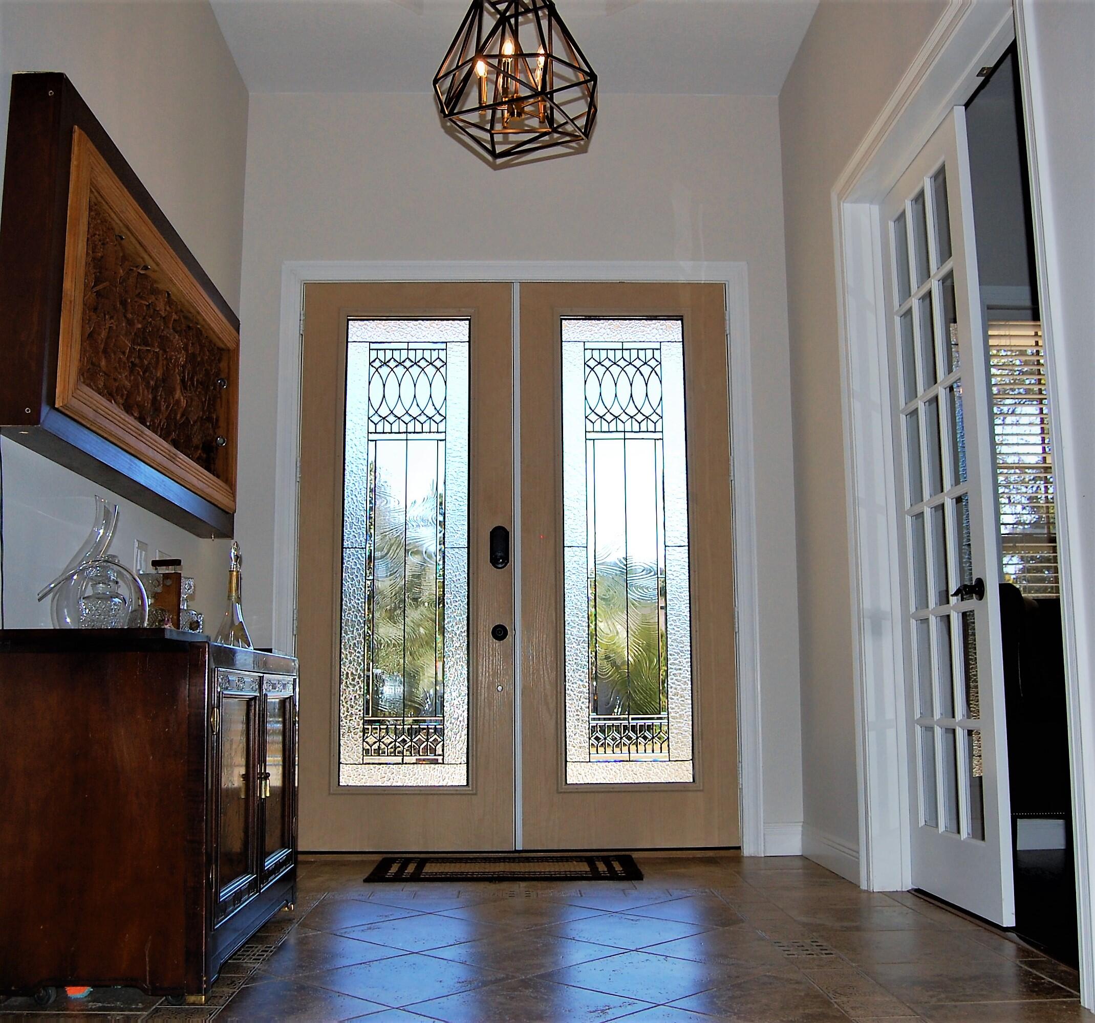 2497 Crescent Road Navarre, FL 32566 - Photo 12 of 51 a view of an empty room with a window and wooden floor