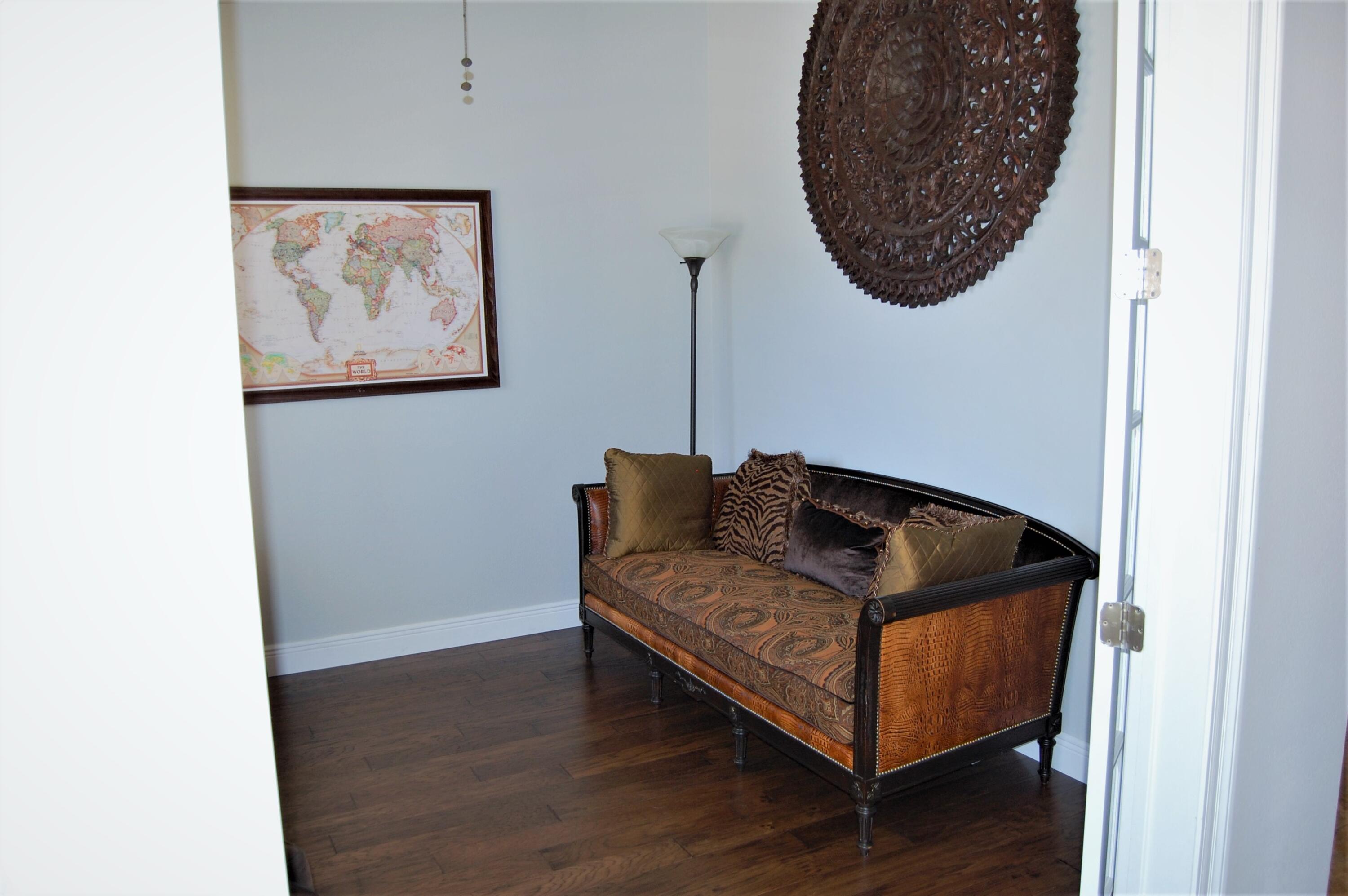 2497 Crescent Road Navarre, FL 32566 - Photo 15 of 51 a living room with furniture and a wall painting