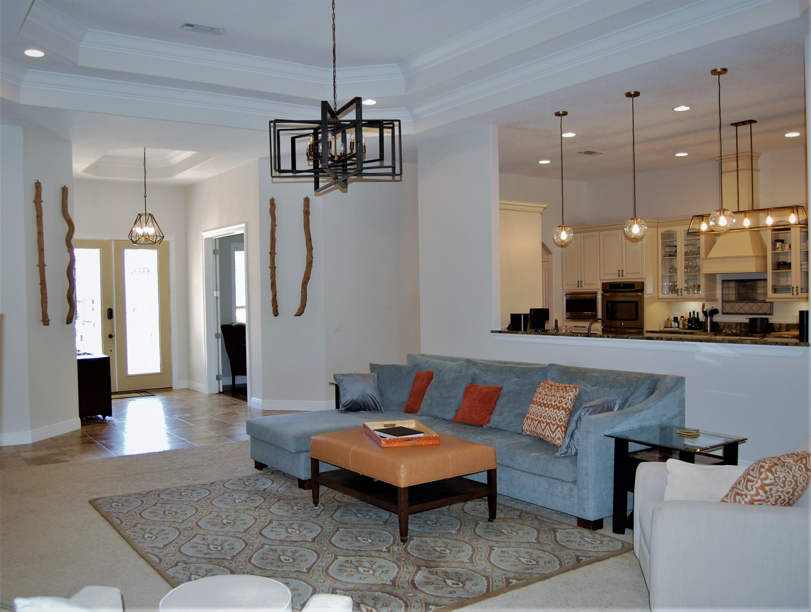 2497 Crescent Road Navarre, FL 32566 - Photo 16 of 51 a living room with furniture and kitchen view
