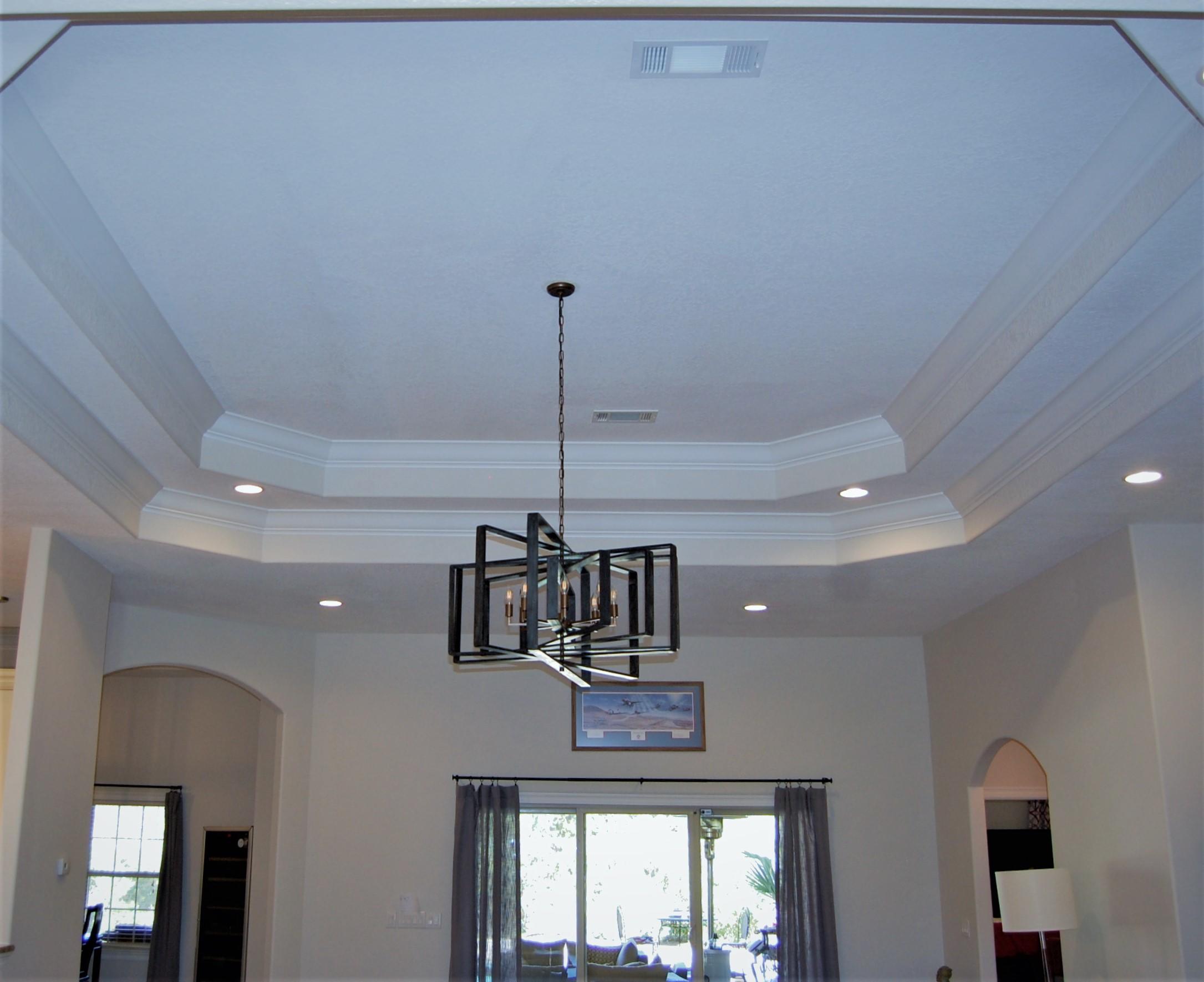 2497 Crescent Road Navarre, FL 32566 - Photo 19 of 51 a view of a room with a chandelier fan and windows