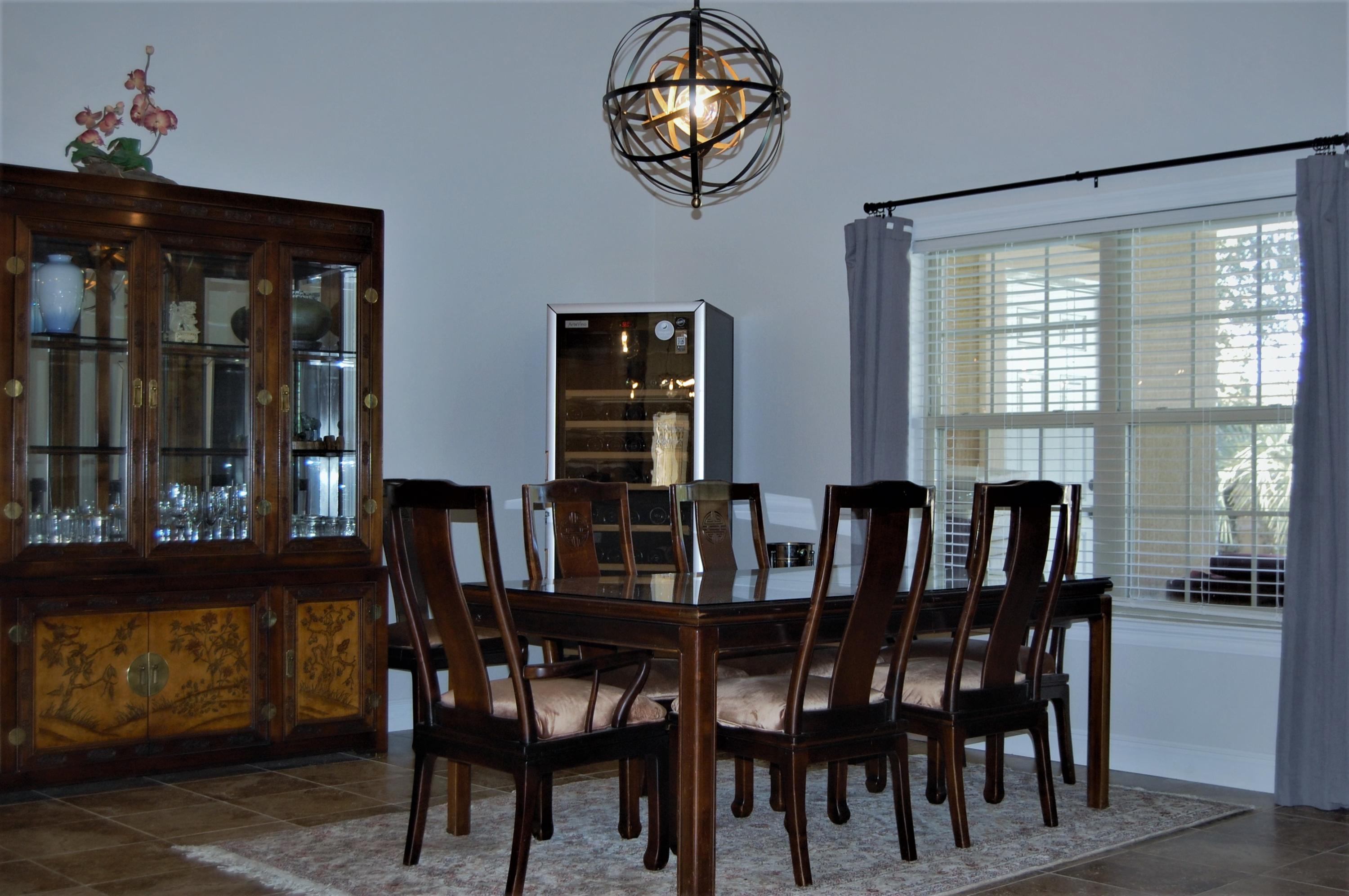 2497 Crescent Road Navarre, FL 32566 - Photo 20 of 51 a view of a dining room with furniture window and outside view