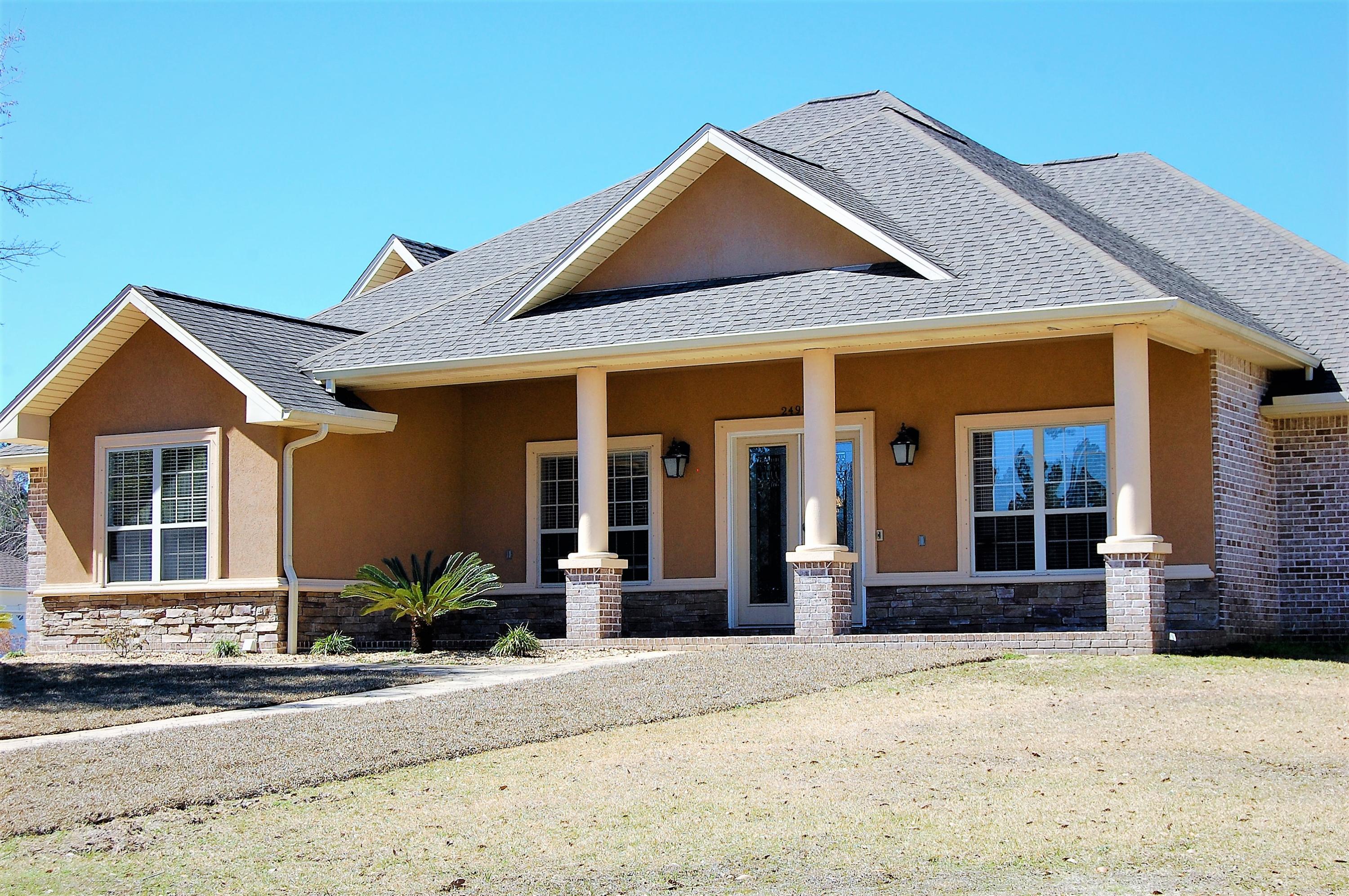 2497 Crescent Road Navarre, FL 32566 - Photo 2 of 51 a front view of a house with a yard