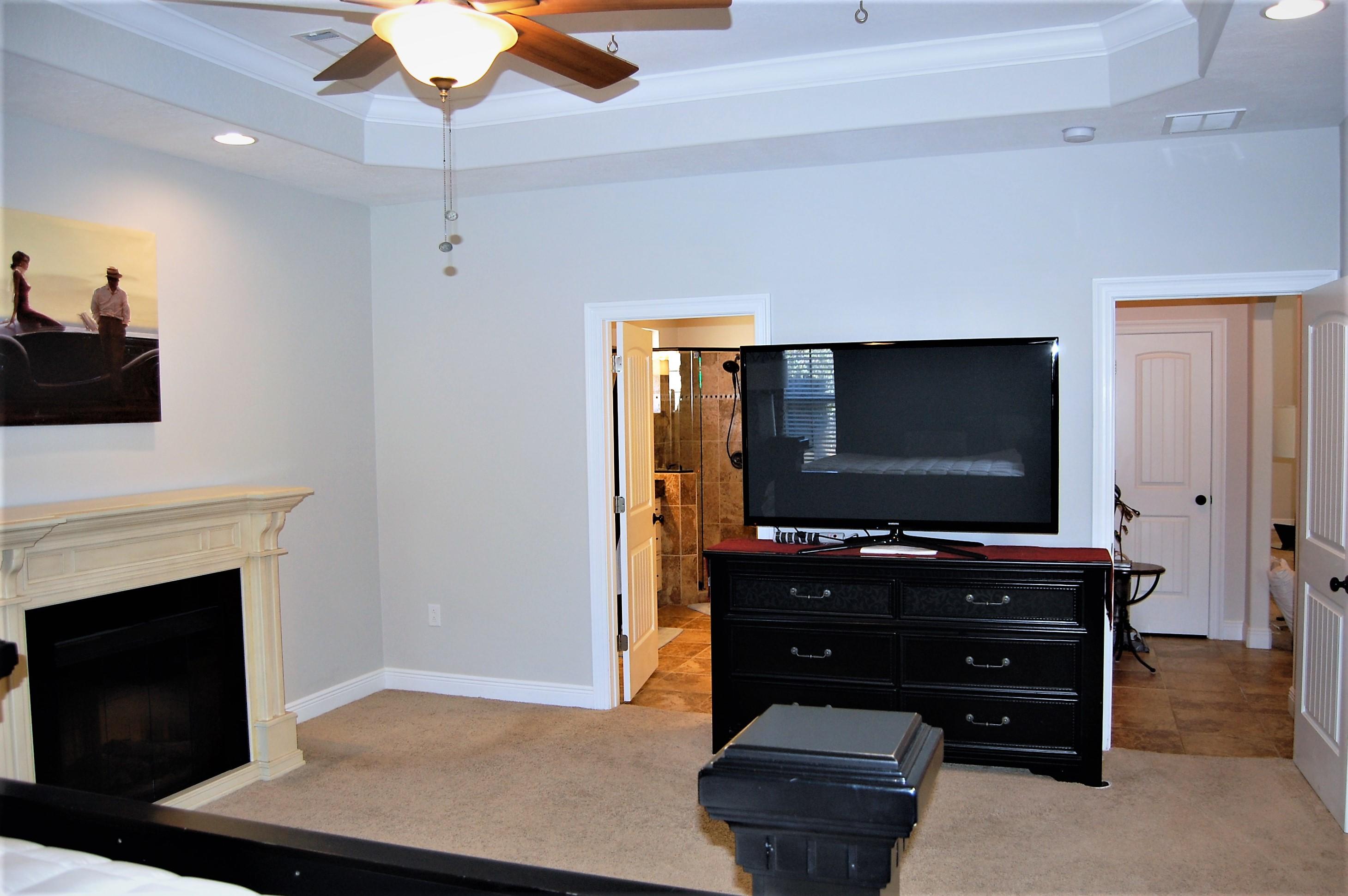 2497 Crescent Road Navarre, FL 32566 - Photo 23 of 51 a room with furniture and flat screen tv