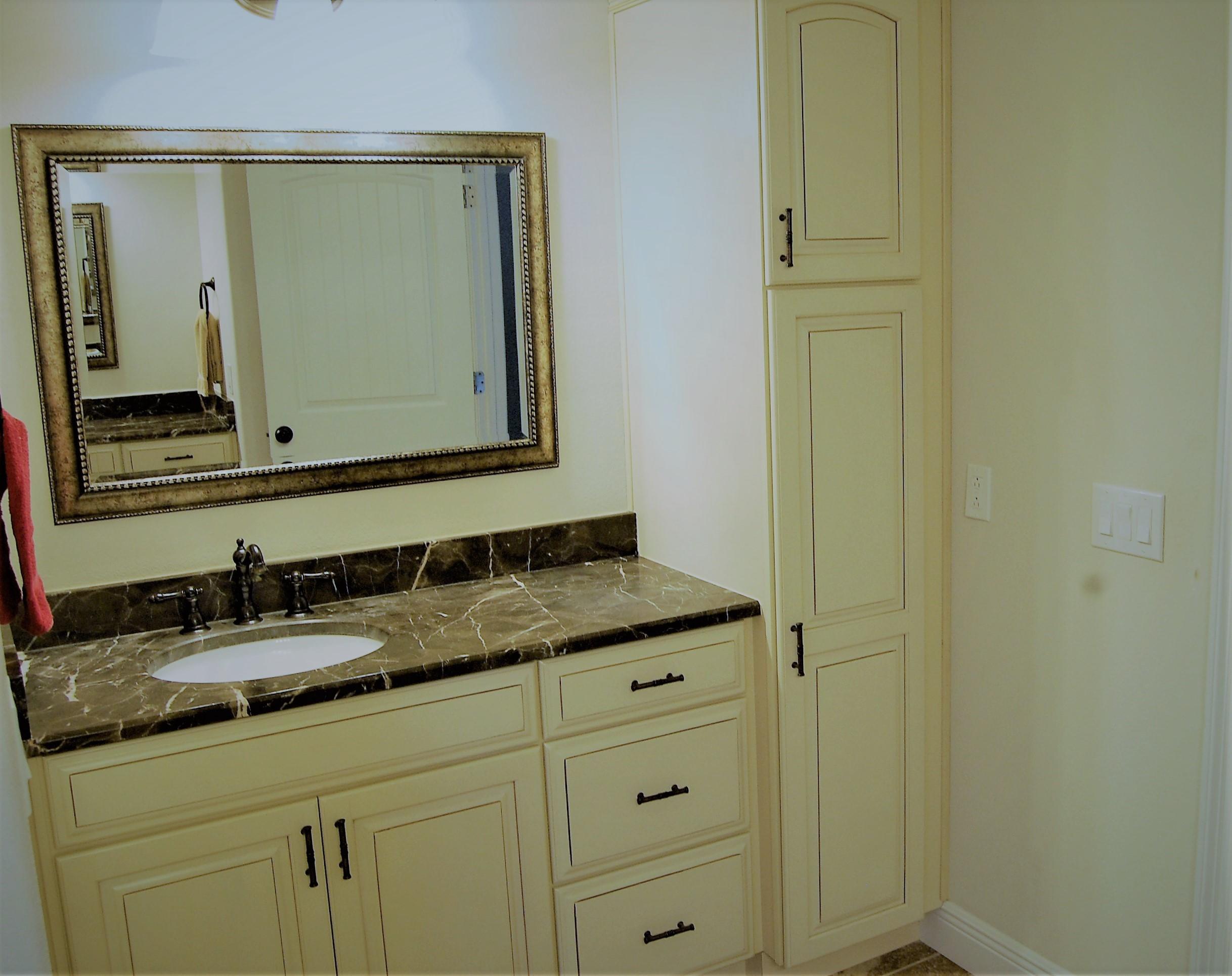 2497 Crescent Road Navarre, FL 32566 - Photo 27 of 51 a bathroom with a granite countertop sink and a mirror
