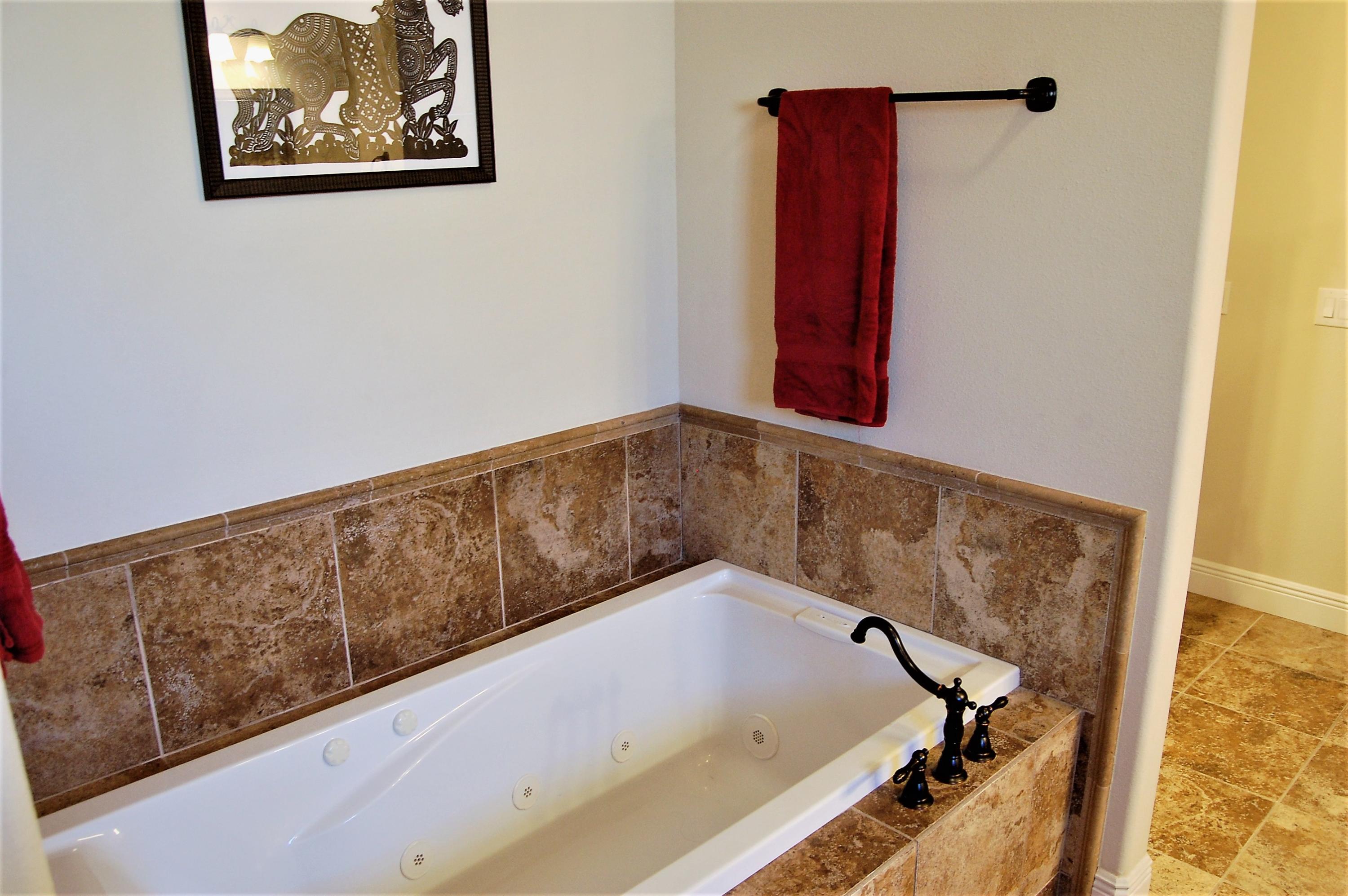 2497 Crescent Road Navarre, FL 32566 - Photo 28 of 51 a view of a bathtub in a bathroom