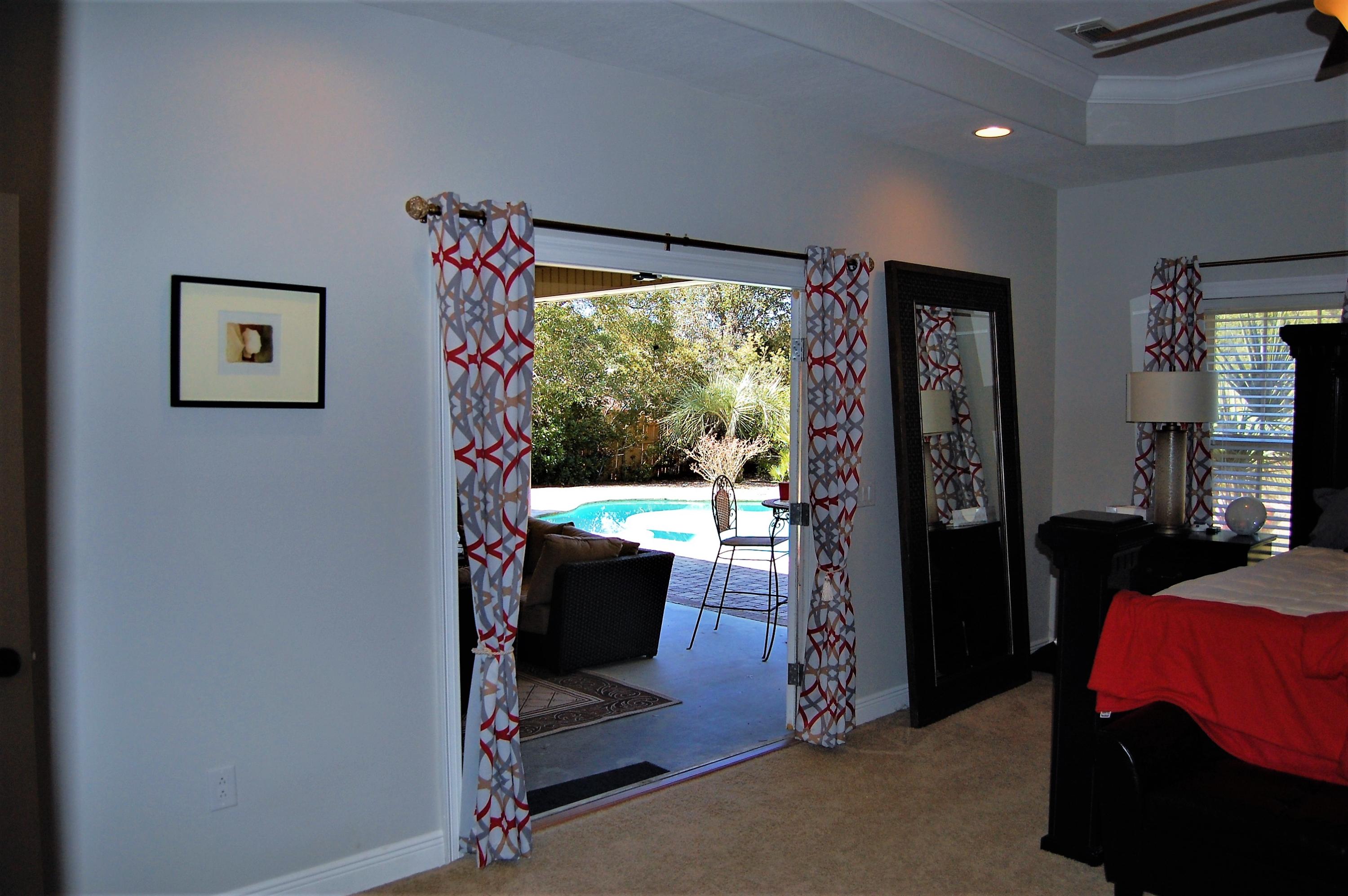 2497 Crescent Road Navarre, FL 32566 - Photo 30 of 51 a view of a livingroom with workspace and a window