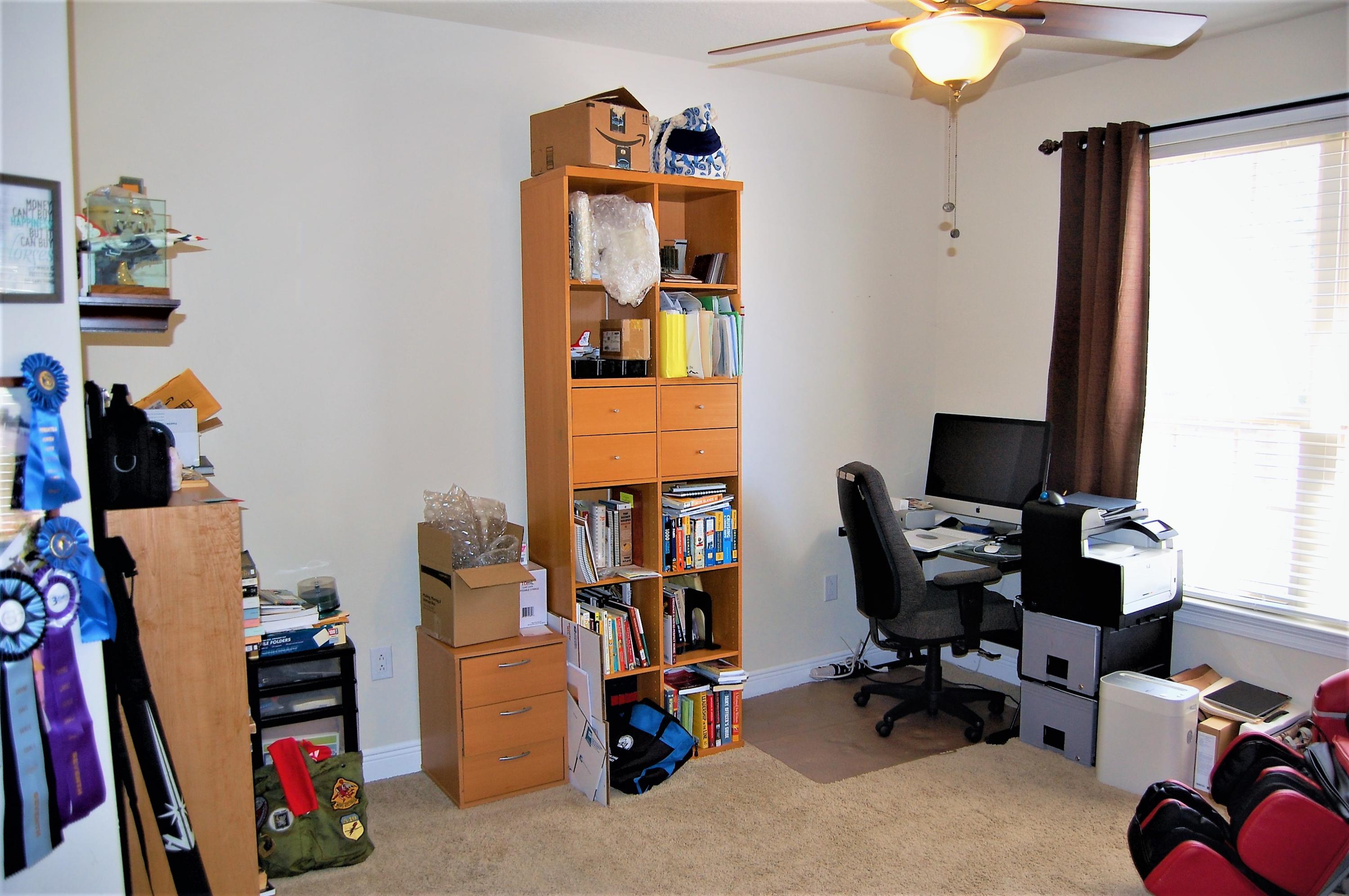 2497 Crescent Road Navarre, FL 32566 - Photo 33 of 51 a view of a workspace with furniture and a window