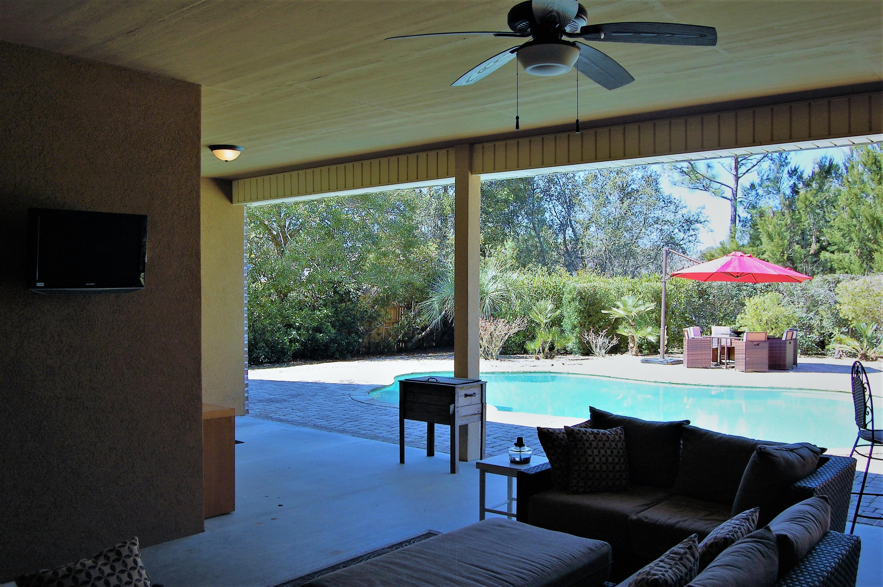 2497 Crescent Road Navarre, FL 32566 - Photo 40 of 51 a balcony with furniture and a yard