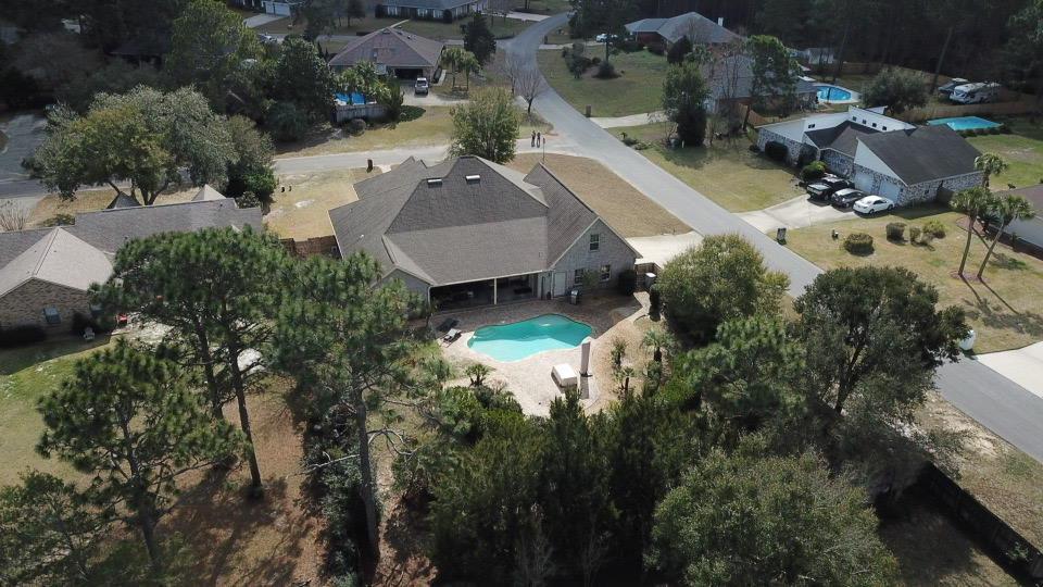 2497 Crescent Road Navarre, FL 32566 - Photo 47 of 51 an aerial view of a house with a yard and lake view