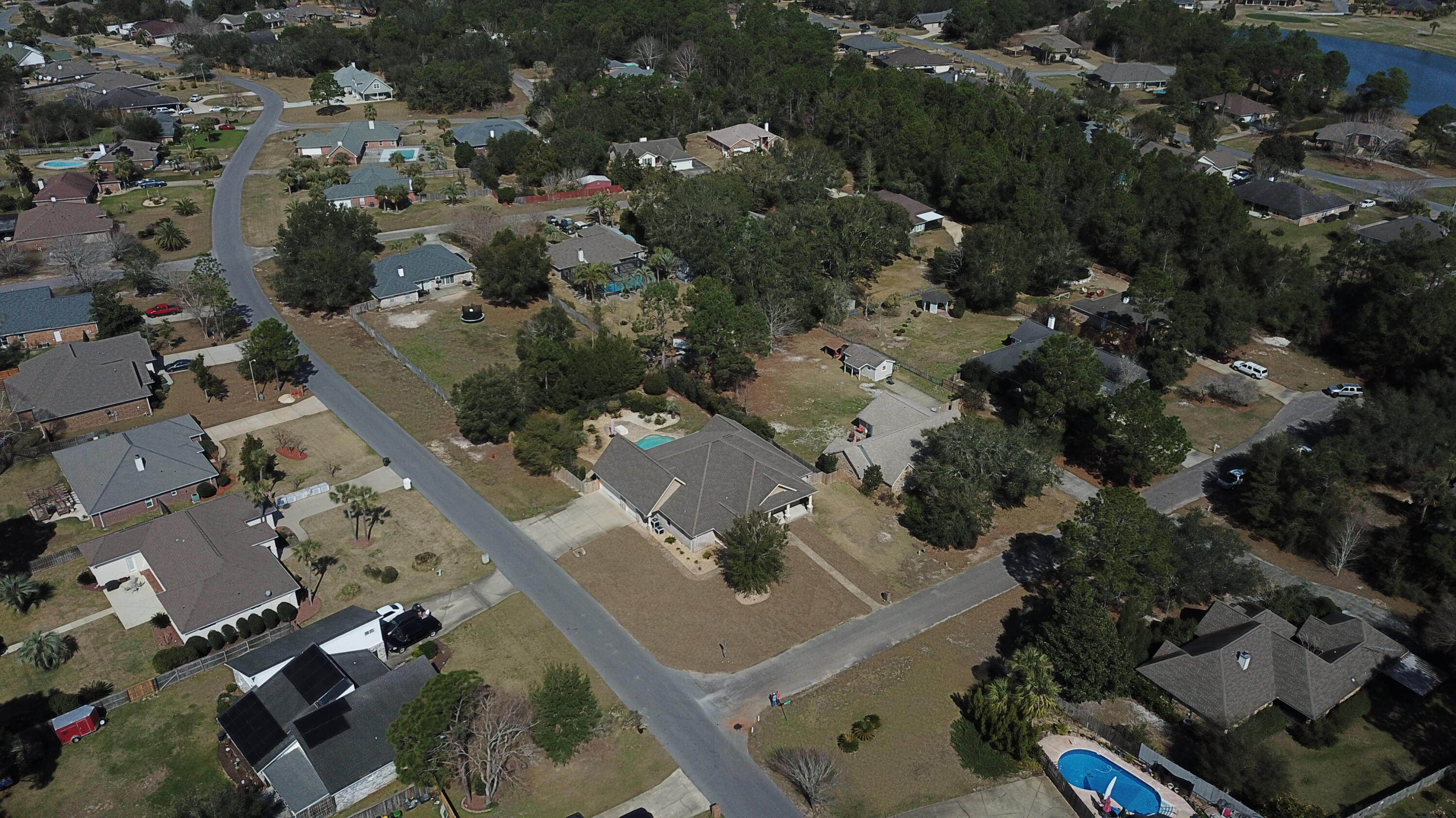 2497 Crescent Road Navarre, FL 32566 - Photo 50 of 51 an aerial view of residential houses with outdoor space