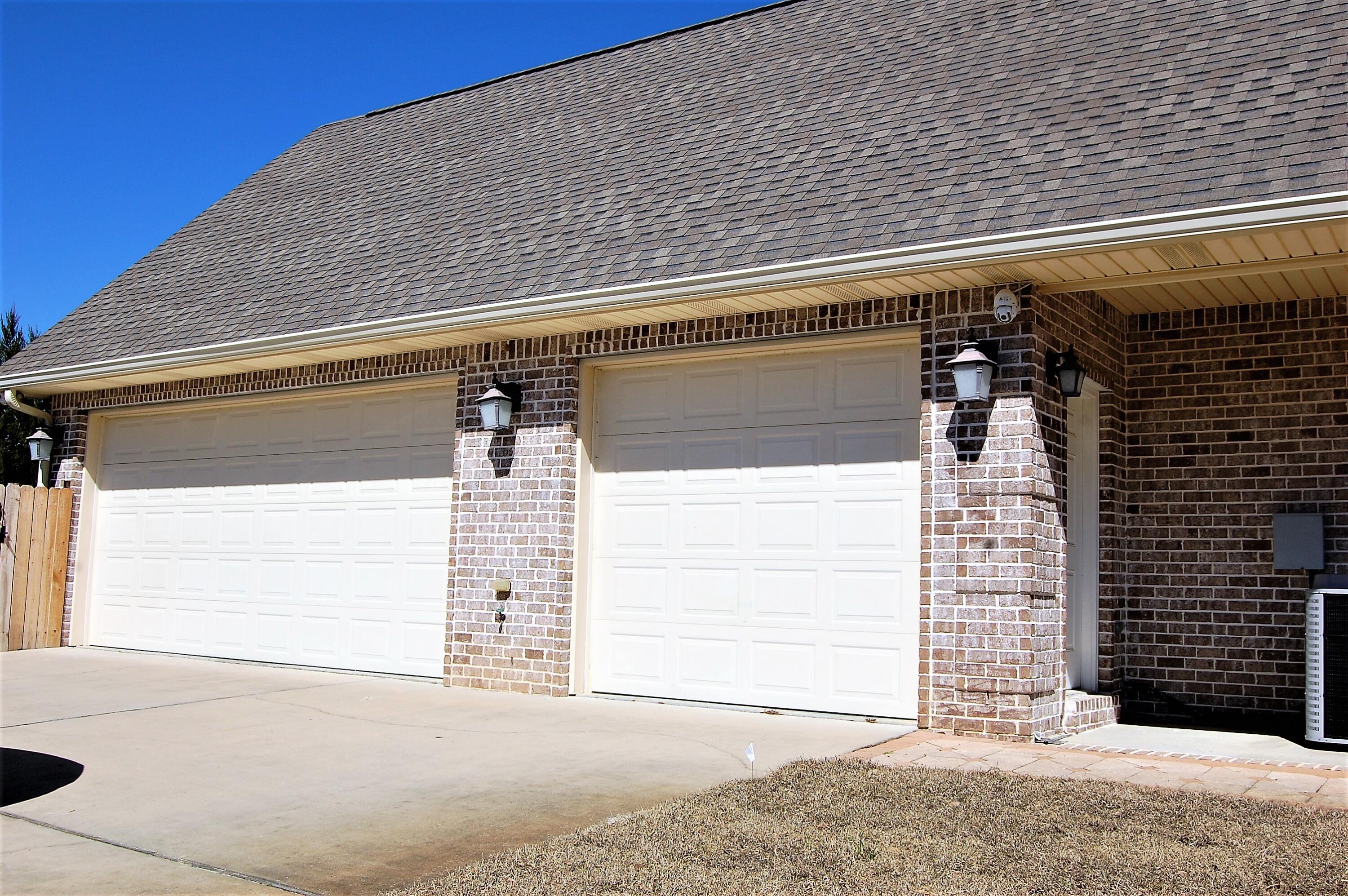 2497 Crescent Road Navarre, FL 32566 - Photo 6 of 51 a side view of a house with garage