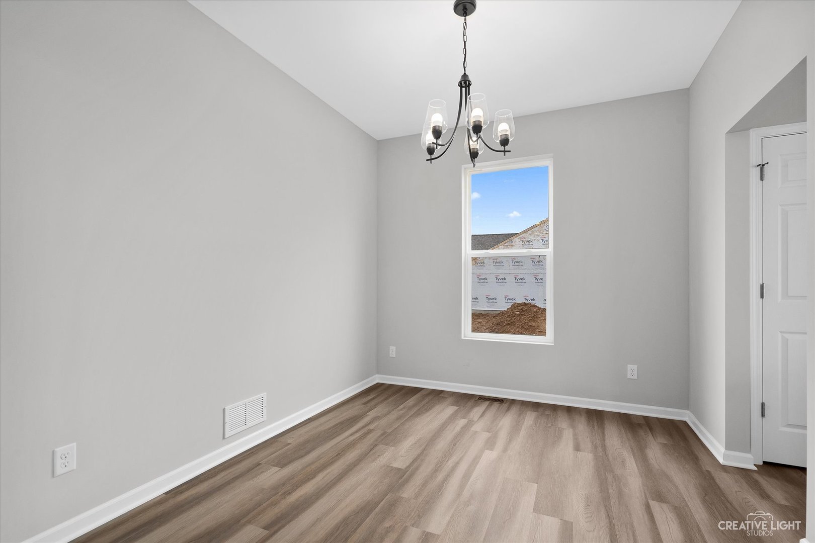 360 North Charles Street Cortland, IL 60112 - Photo 12 of 33 a view of an empty room with a window