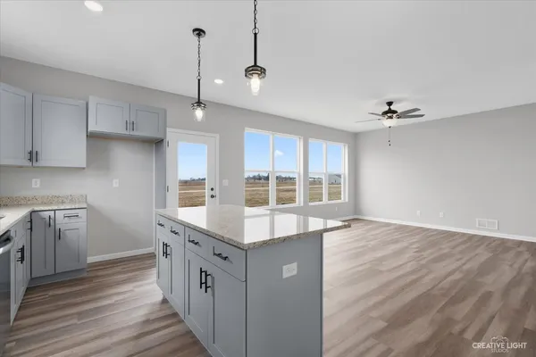 a kitchen with a stove and a kitchen island