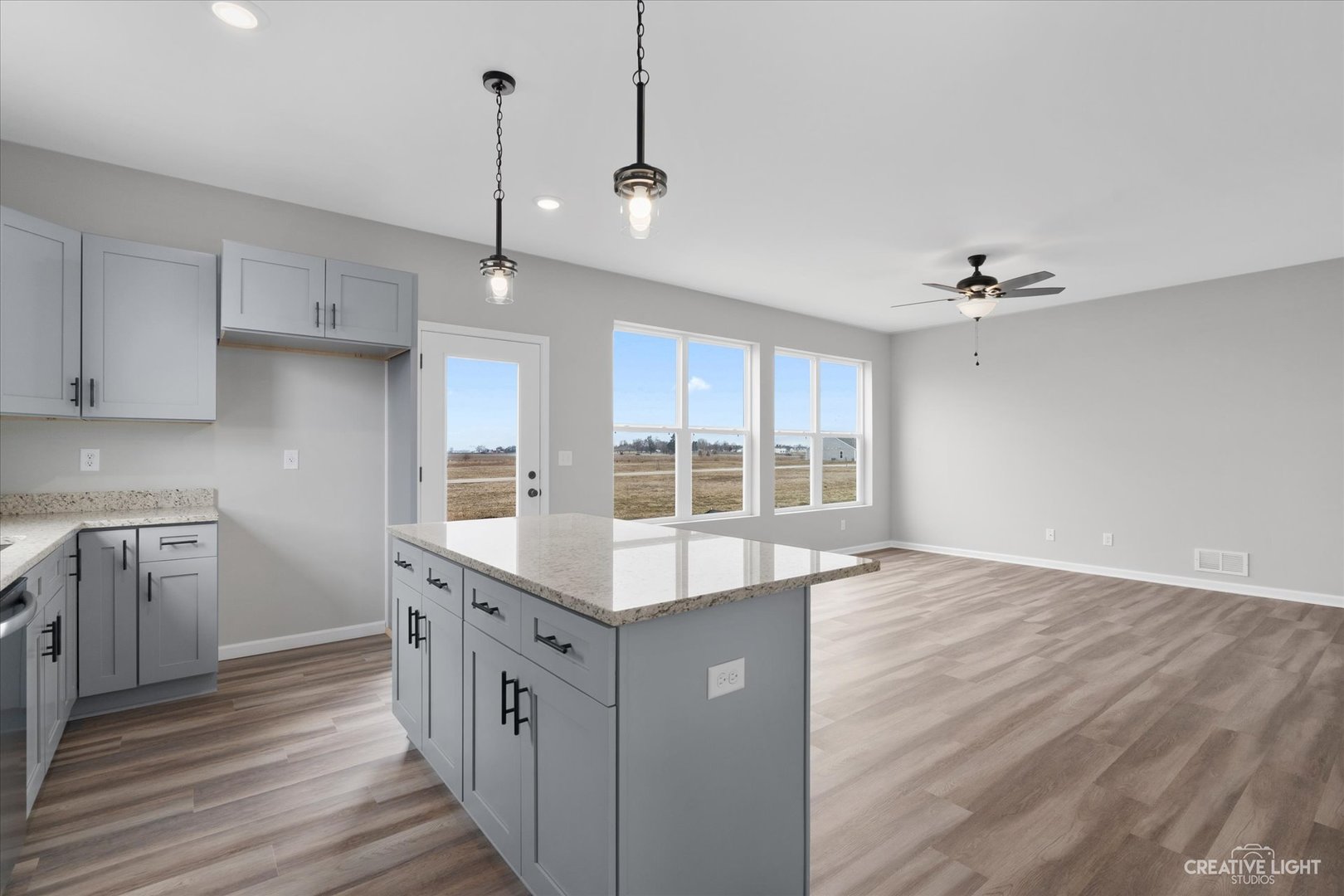 360 North Charles Street Cortland, IL 60112 - Photo 16 of 33 a kitchen with a stove and a kitchen island