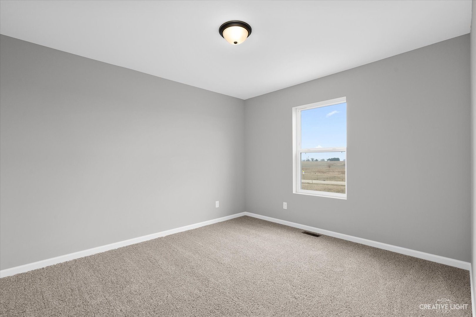360 North Charles Street Cortland, IL 60112 - Photo 25 of 33 an empty room with windows