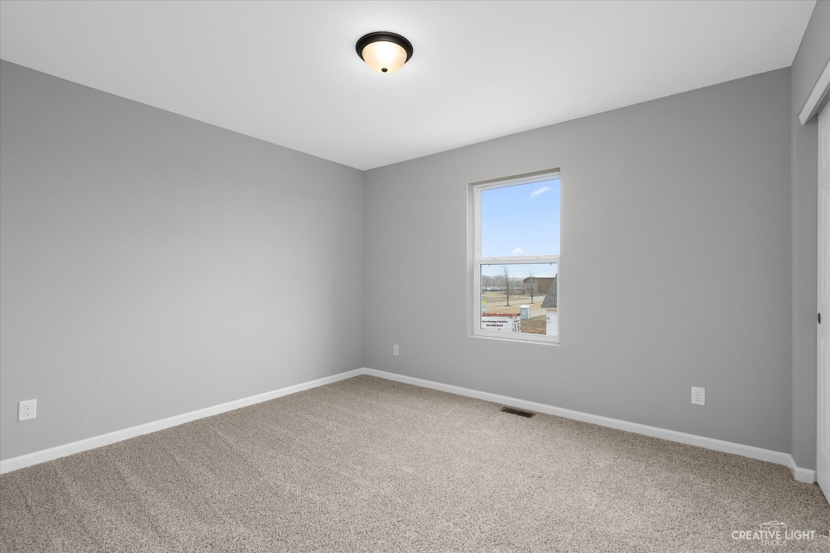 360 North Charles Street Cortland, IL 60112 - Photo 27 of 33 an empty room with a window