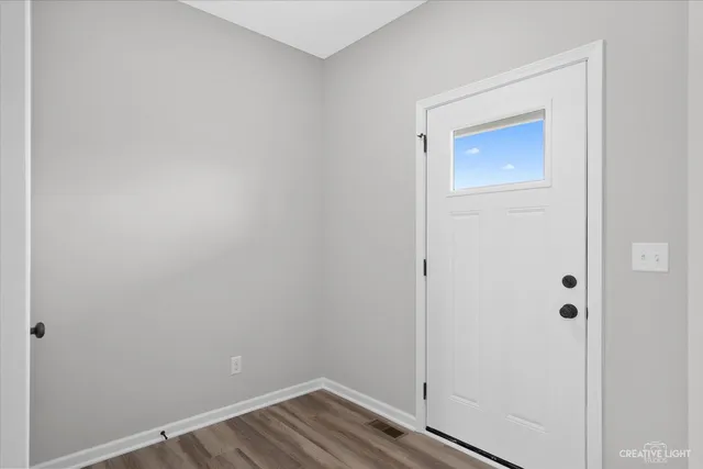 a view of small space with wooden floor