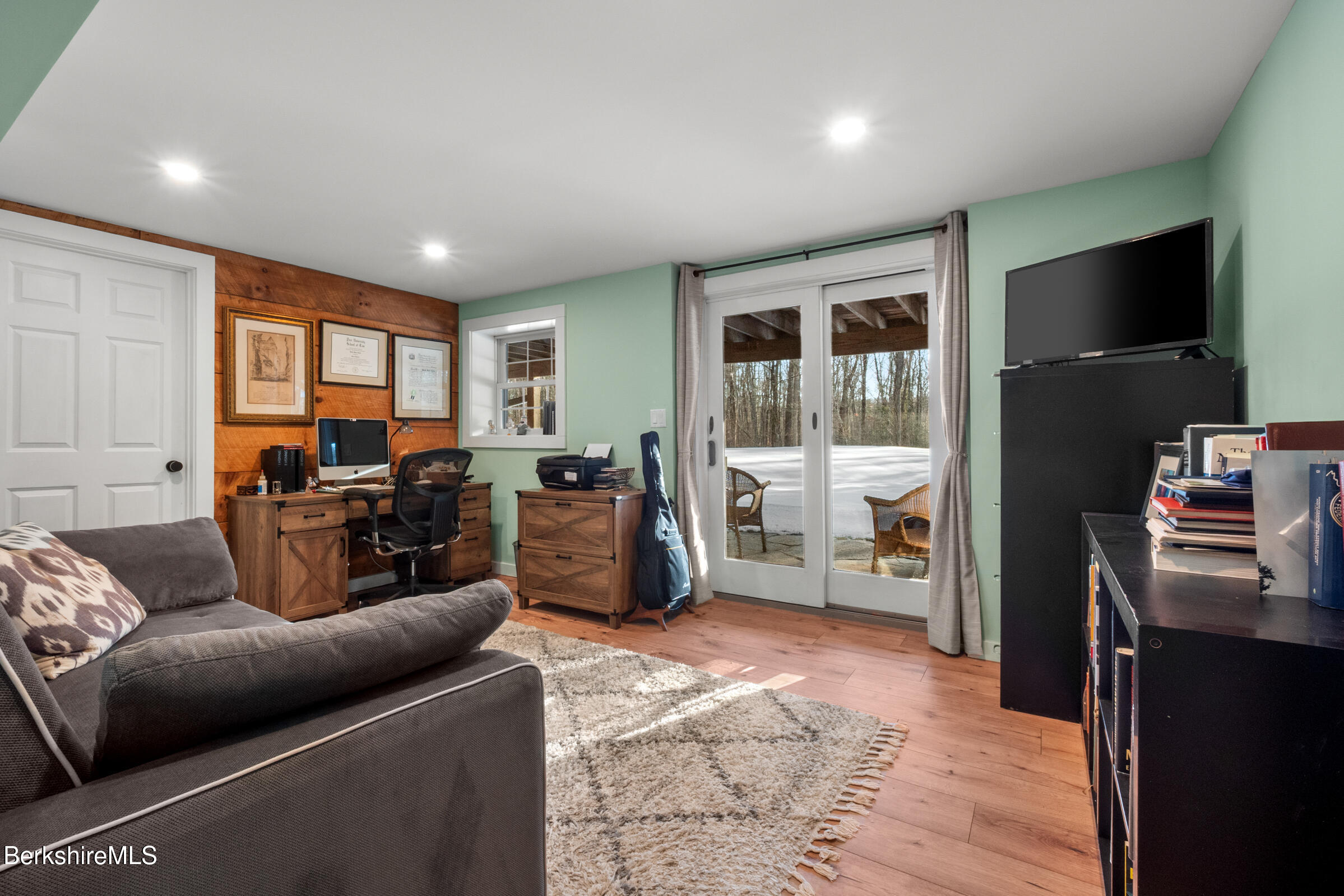 594 Shunpike Road Sheffield, MA 01222 - Photo 31 of 52 a living room with furniture and a flat screen tv