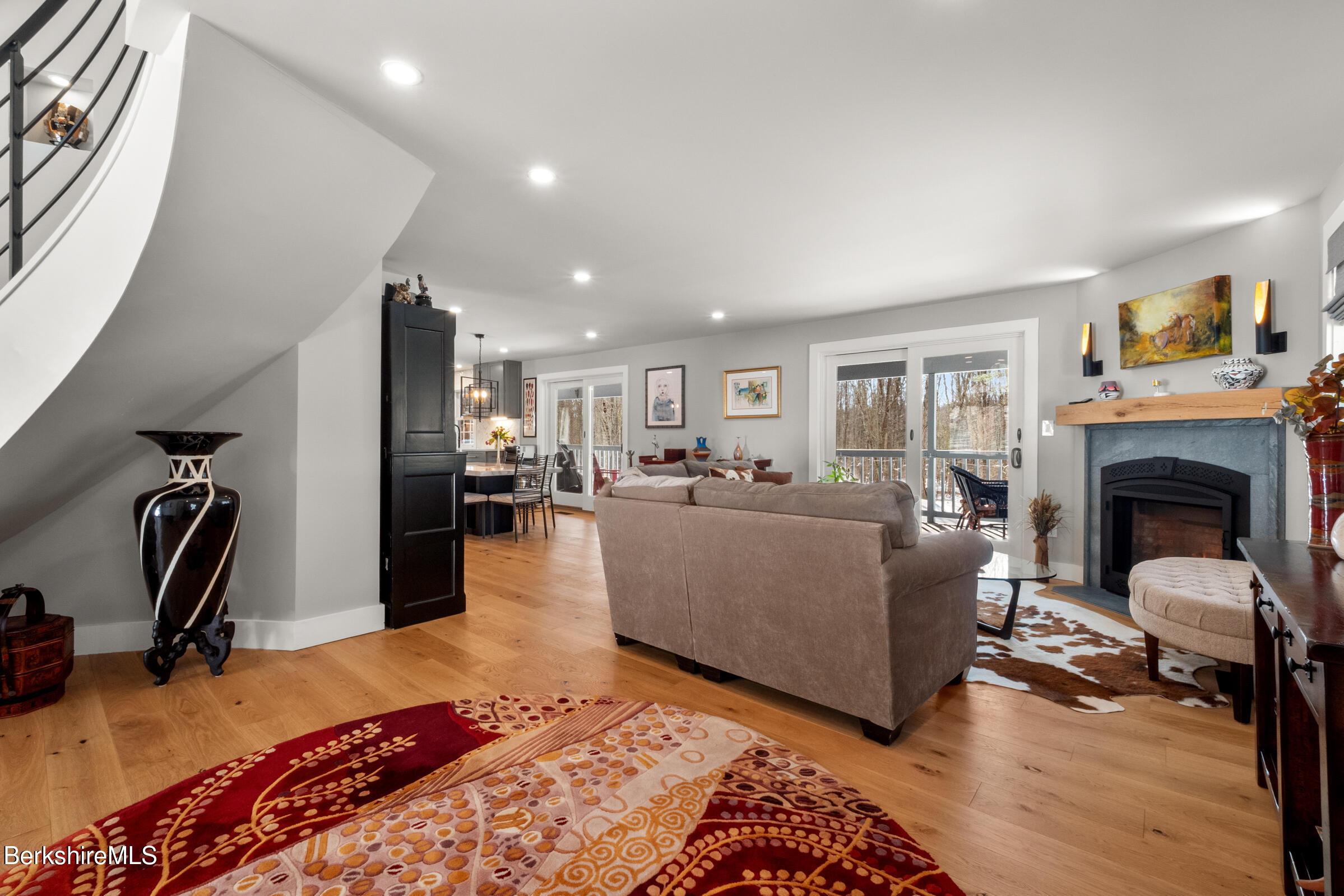 594 Shunpike Road Sheffield, MA 01222 - Photo 44 of 52 a living room with furniture a fireplace and kitchen view