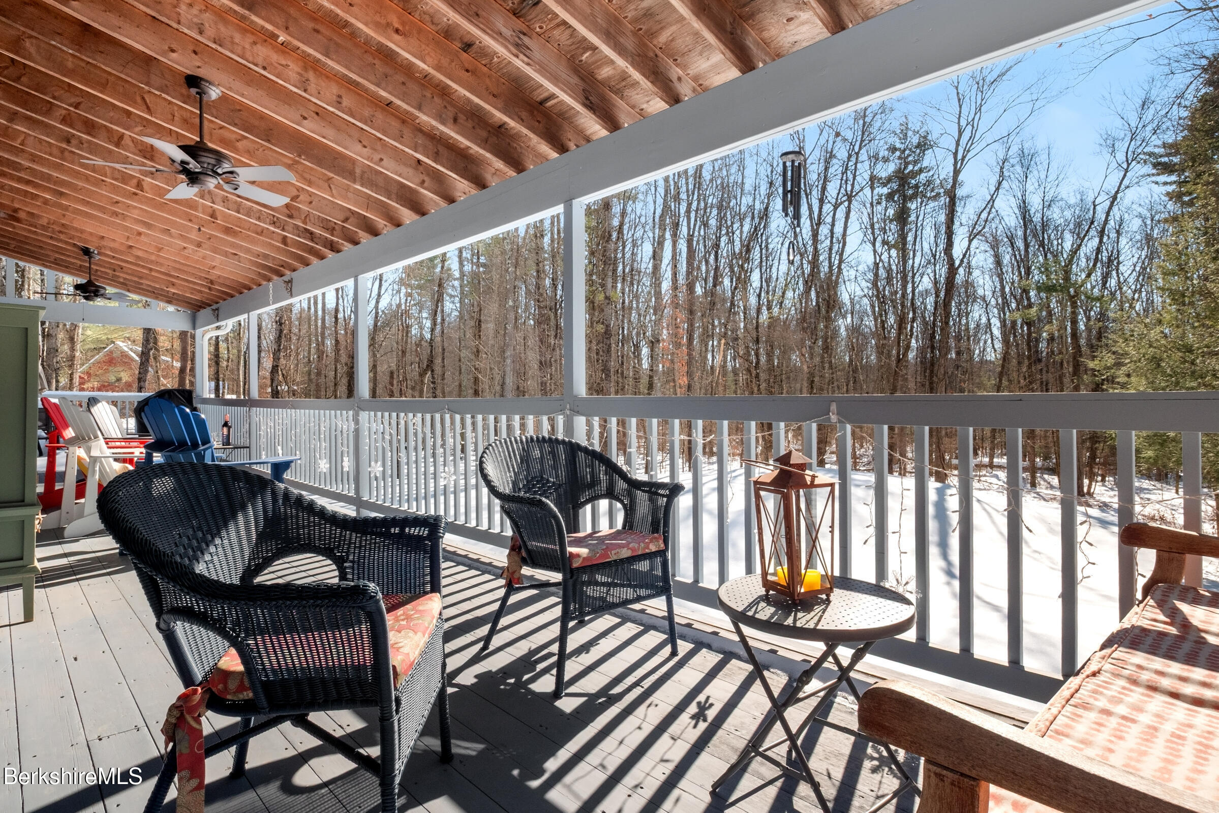 594 Shunpike Road Sheffield, MA 01222 - Photo 50 of 52 a view of a chairs and table in patio with wooden fence