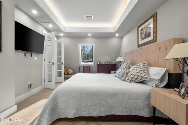 a bedroom with a bed and a view of bathroom