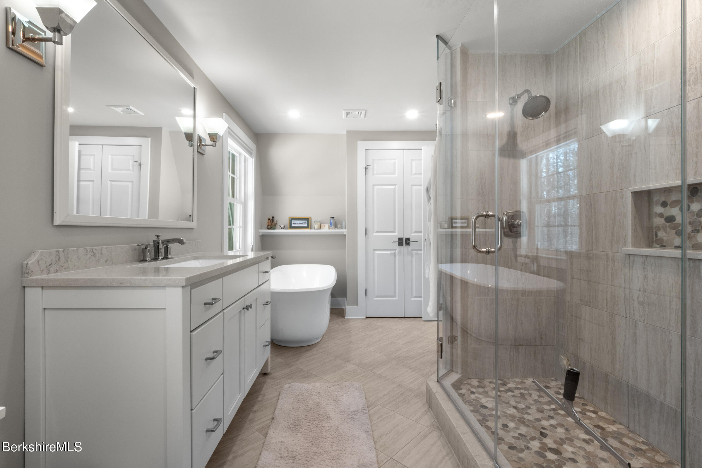 594 Shunpike Road Sheffield, MA 01222 - Photo 7 of 52 a bathroom with a double vanity sink toilet mirror and shower