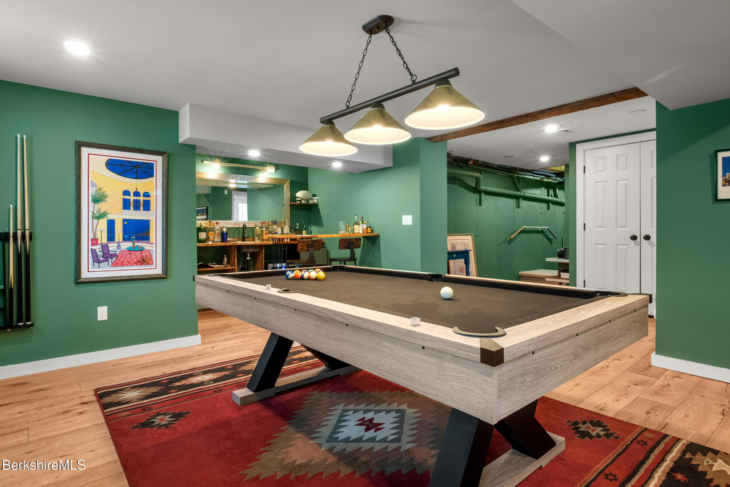 594 Shunpike Road Sheffield, MA 01222 - Photo 8 of 52 a room with lots of wooden furniture and a chandelier