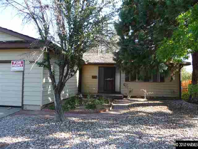 3090 Slater Avenue Reno, NV 89503 - Photo 1 of 9 a front view of a house with a yard and tree s
