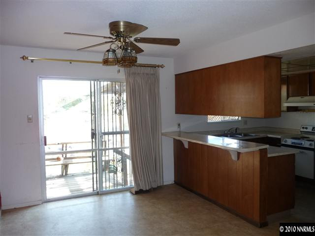 3090 Slater Avenue Reno, NV 89503 - Photo 4 of 9 a kitchen with stainless steel appliances granite countertop a stove a sink and a microwave