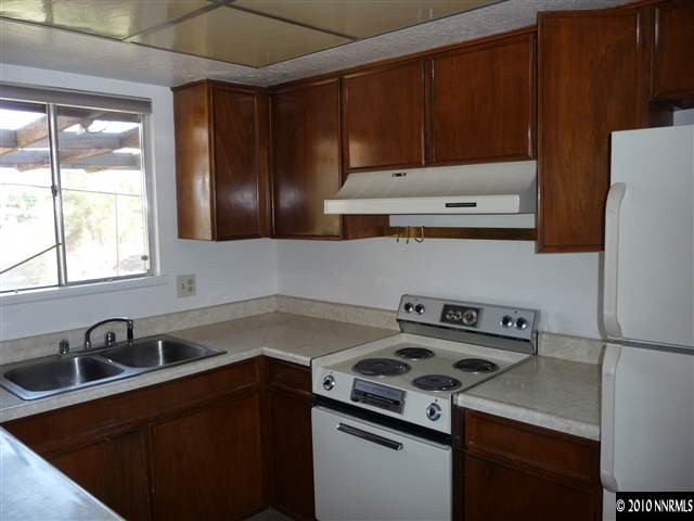 3090 Slater Avenue Reno, NV 89503 - Photo 5 of 9 a kitchen with a sink a stove and cabinets