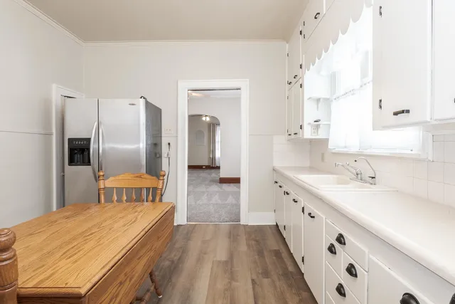 a bathroom with a sink a mirror and a shower