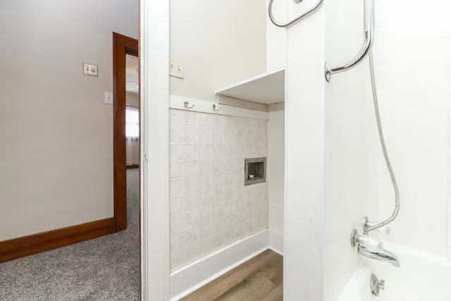 a bathroom with a glass shower door