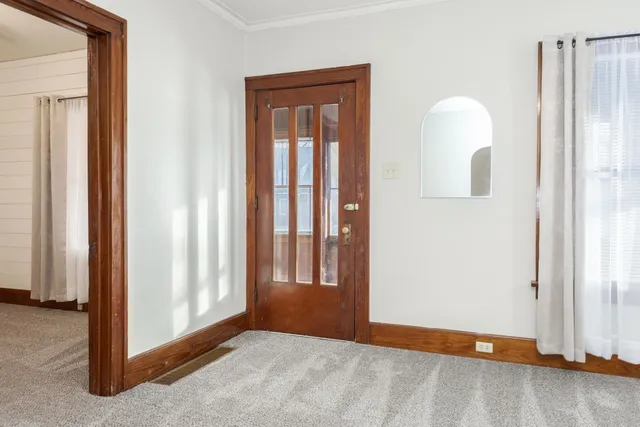 a view of an empty room with windows