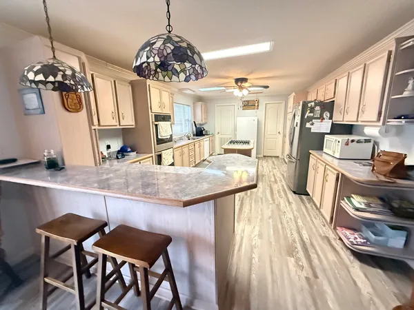 a bathroom with a sink toilet and mirror