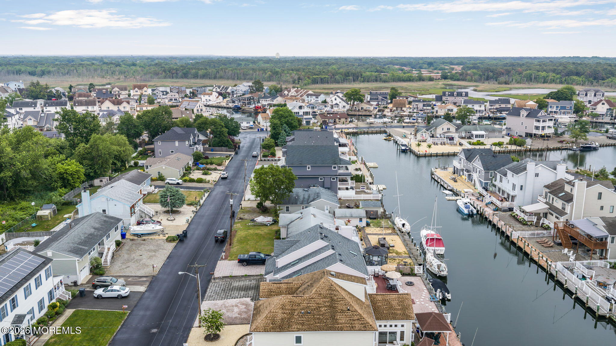 9 Cross Trees Road Brick, NJ 08723 - Photo 107 of 126 an aerial view of a city with lots of residential buildings lake and ocean view