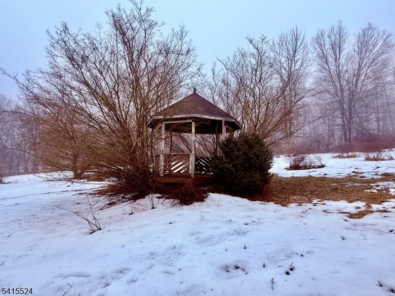 150 Karrville Road Port Murray, NJ 07865 - Photo 34 of 40 a front view of a house with a yard covered in snow