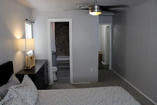 a living room with furniture and lamp