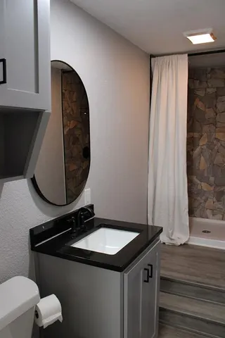 a bathroom with a sink and a mirror