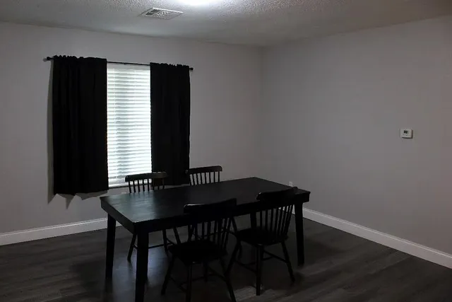 a table and chairs in a small space