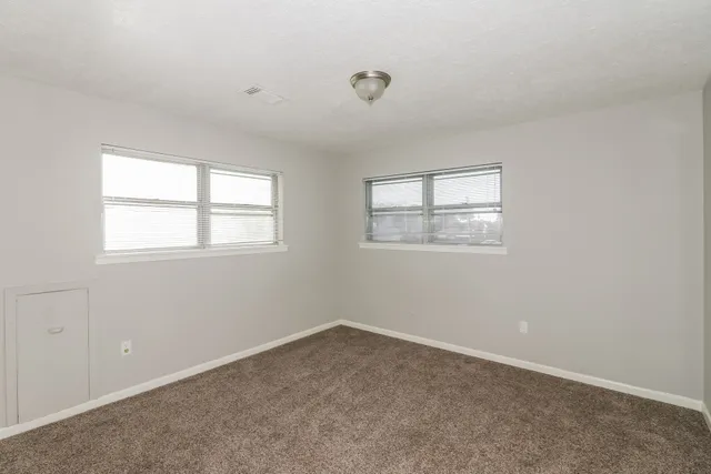 an empty room with windows