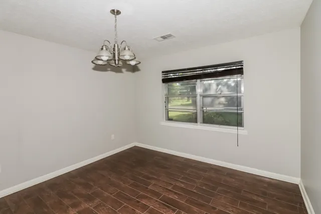 a decorative lighting & window in an empty room