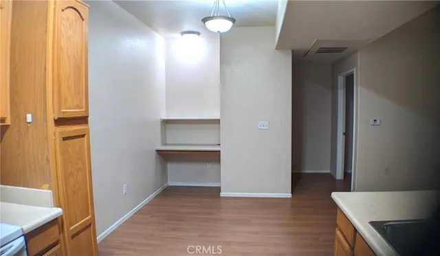 a view of a room with wooden floor and staircase