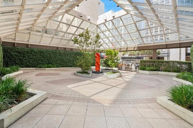 a view of a pathway with a house in the background