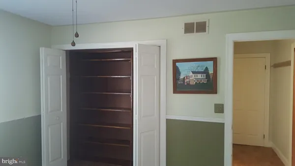 a view of a hallway with closet