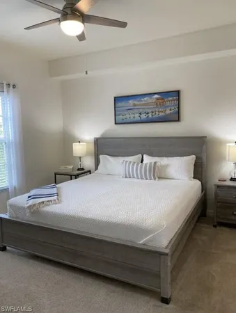 a bedroom with bed and a window