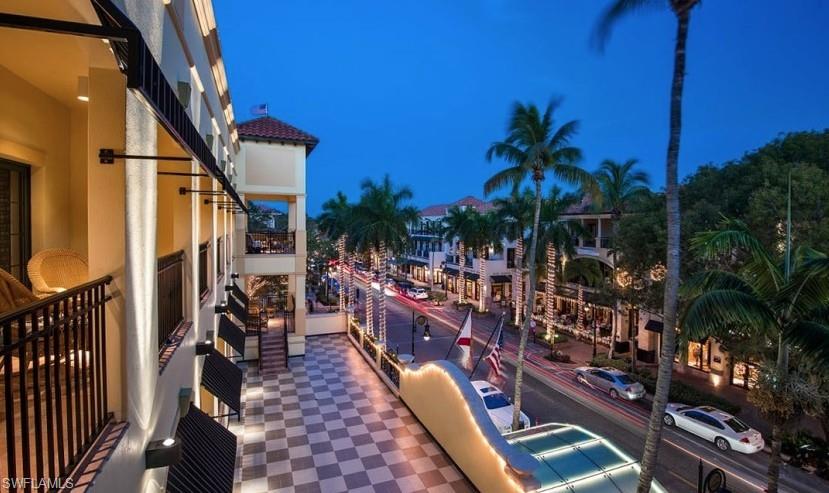 4430 Botanical Pl Circle, Unit 303 Naples, FL 34112 - Photo 18 of 22 a view of outdoor space with seating area and trees
